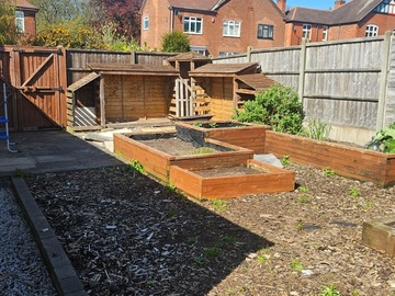 Earn a Monthly Rent: Good size south facing plot with shed and planters 