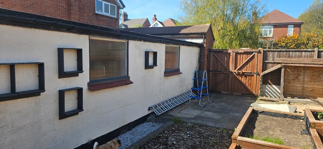 Good size south facing plot with shed and planters 